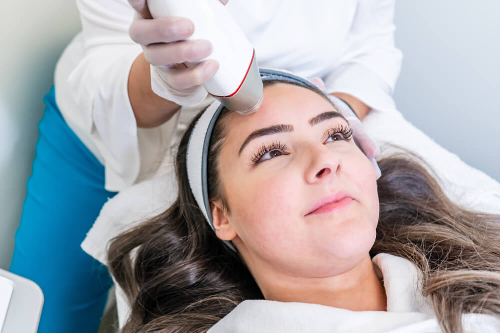 woman receiving laser treatment