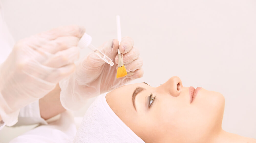 Woman having chemical peel