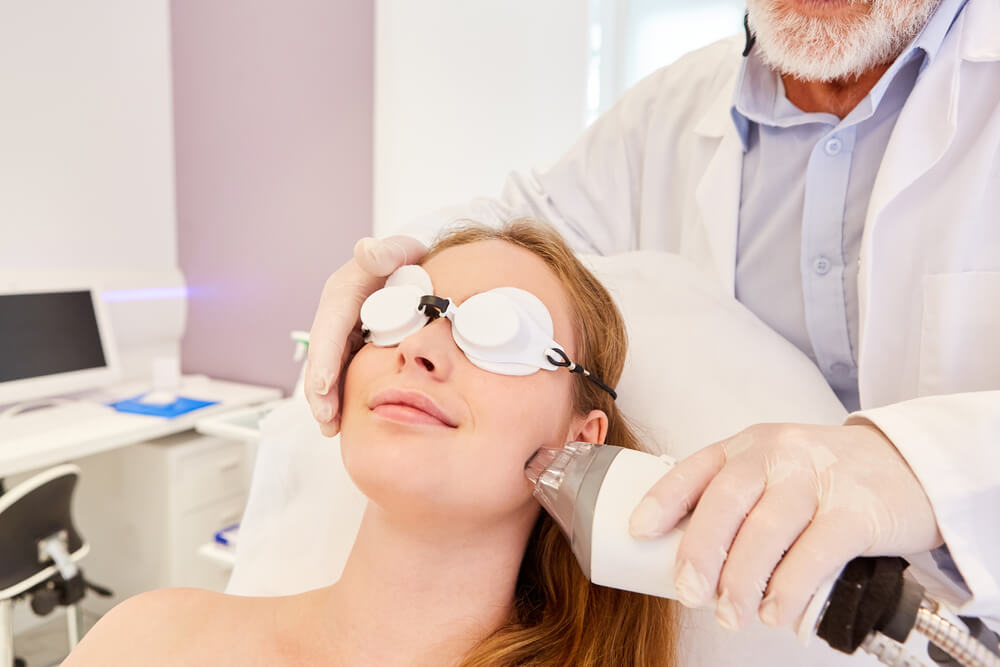 Woman having laser treatment