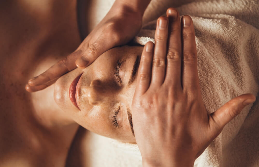 woman receiving facial